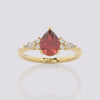 Garnet Melody Side Stones Pear Ring