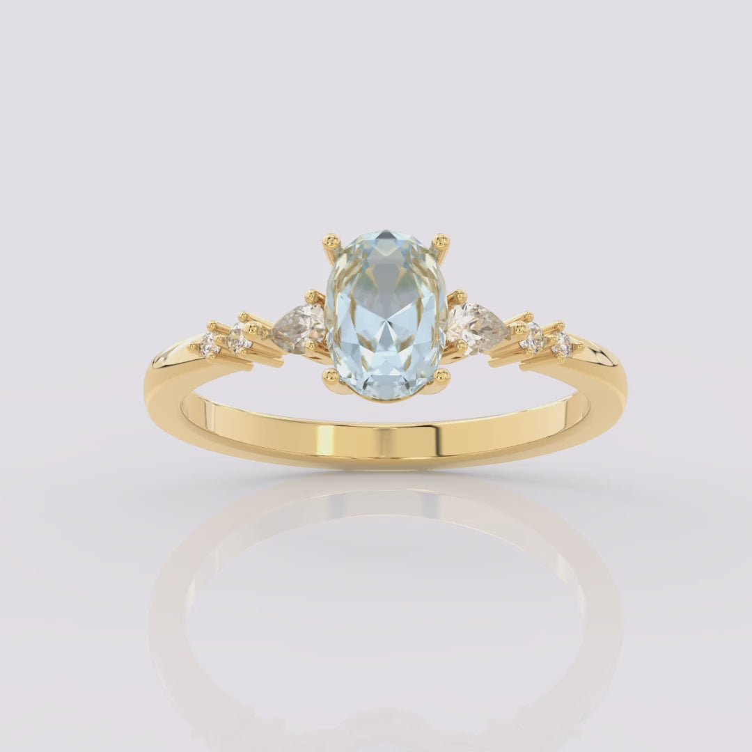 Aquamarine Ellipsis Side Stones Oval Ring